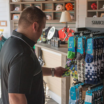 A guest looks at Stance Socks at the Pro Shop