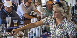 Cheer on the entertainment from a barstool at the Bucker Bar